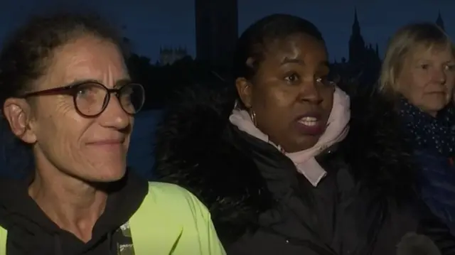 Three women who are part of the queue that's fromed on at Lambeth Bridge overnight to see the Queen lying in state