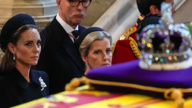 Catherine, Princess of Wales, and Sophie, Countess of Wessex, watch on as the Queen's coffin is carried into Westminster Hall