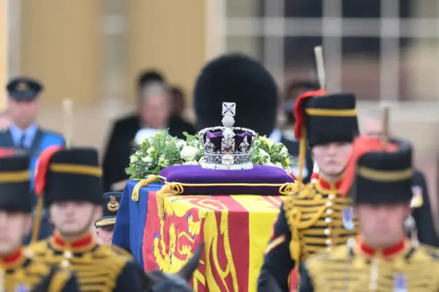 The coffin of Queen Elizabeth II, adorned with a Royal Standard and the Imperial State Crown