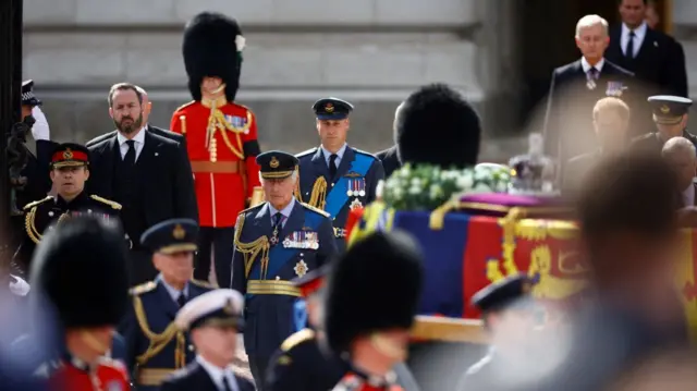 Procession carrying Queen's coffin