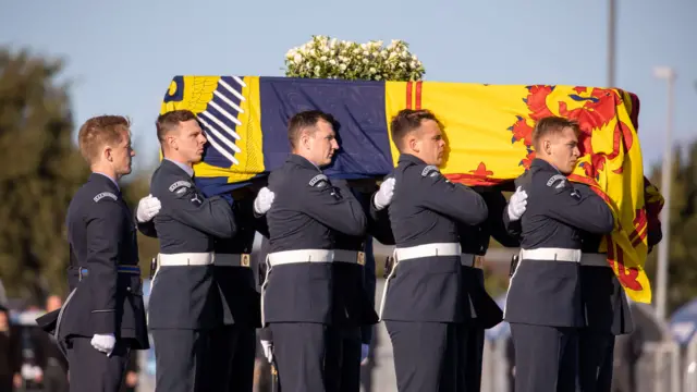 Pallbearers from the Royal Air Force Regiment carrying the coffin of Britain's Queen Elizabeth II at Edinburgh International Airport