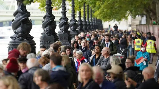 Members of the public join the queue on the South Bank, as they wait to view Queen Elizabeth II lying-in-state