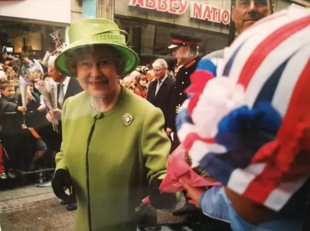 The Queen receiving flowers