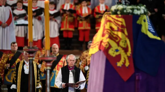 Archbishop of Canterbury Justin Welby reads at the start of a short service