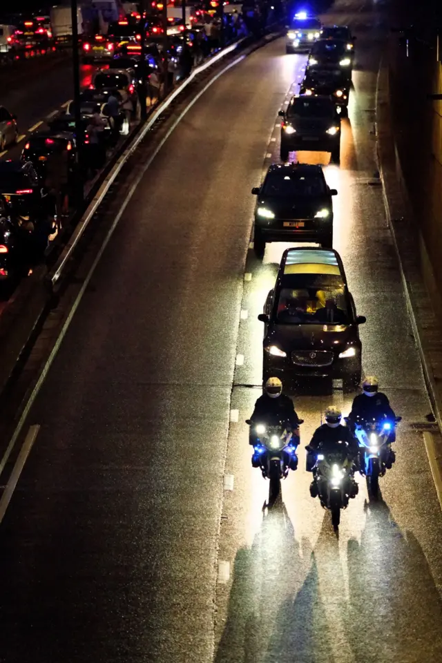 The Queen's hearse travels along the A40 to Buckingham Palace from RAF Northolt