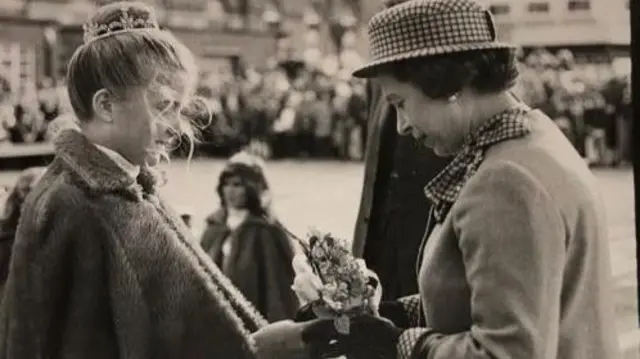 Sara Brown presenting flowers to the Queen in Harwich in 1981