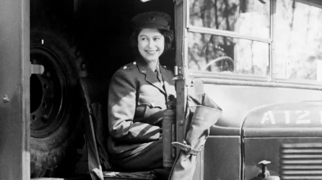 Princess Elizabeth sits in a military vehicle in a photo dated 1945