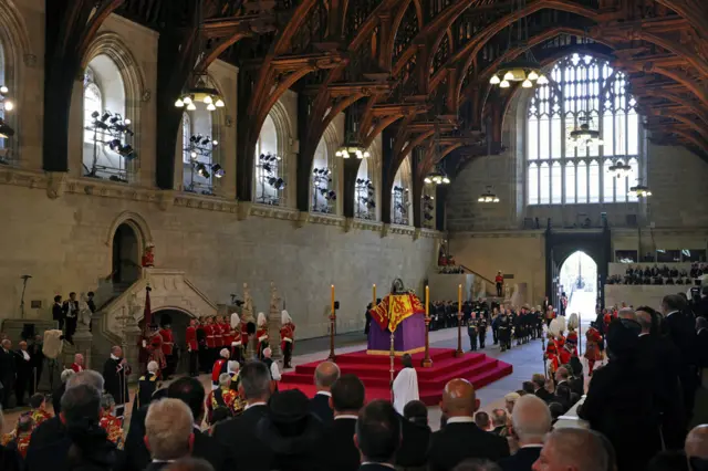 the coffin carrying Queen Elizabeth II rests in Westminster Hall for the Lying-in State on September 14, 2022 in London, England. Queen Elizabeth II's coffin is taken in procession on a Gun Carriage of The King's Troop Royal Horse Artillery from Buckingham Palace to Westminster Hall where she will lay in state until the early morning of her funeral.