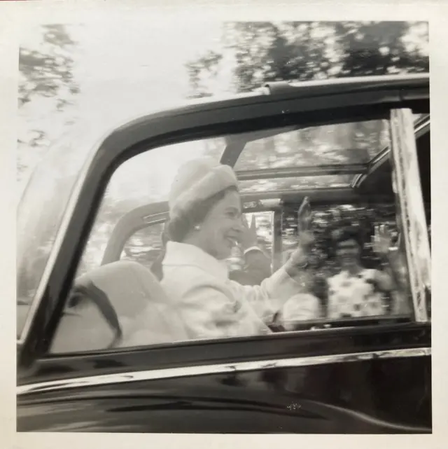 The Queen in her car