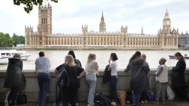 People queuing in front of the Houses of Parliament