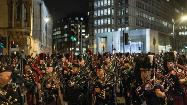 Bagpipers marching in central London