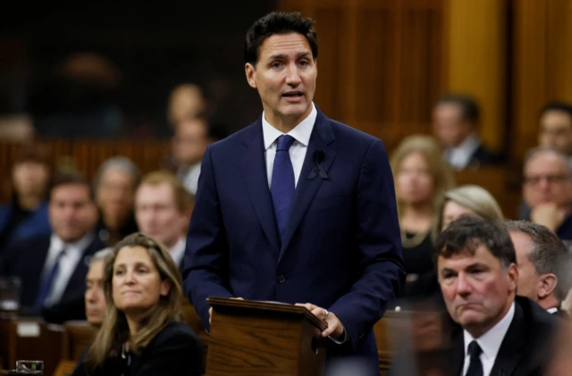 Canada's Prime Minister Justin Trudeau addresses MPs in Ottawa on the death of Queen Elizabeth II