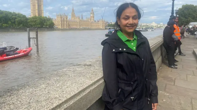 Vanessa Nanthakumaran is pictured before getting in to Westminster Hall to see the Queen lying in state