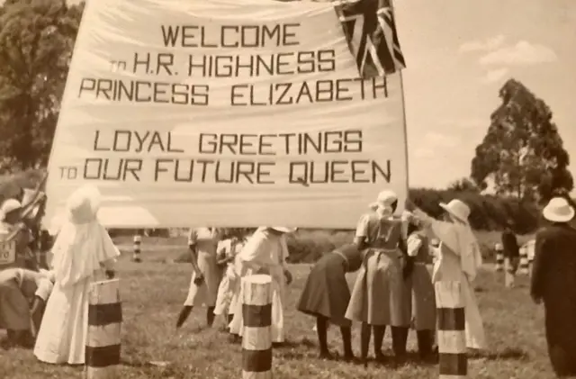 The Catholic Mission in Kenya raises a banner to the future Queen, not knowing just how soon she would accede to the throne