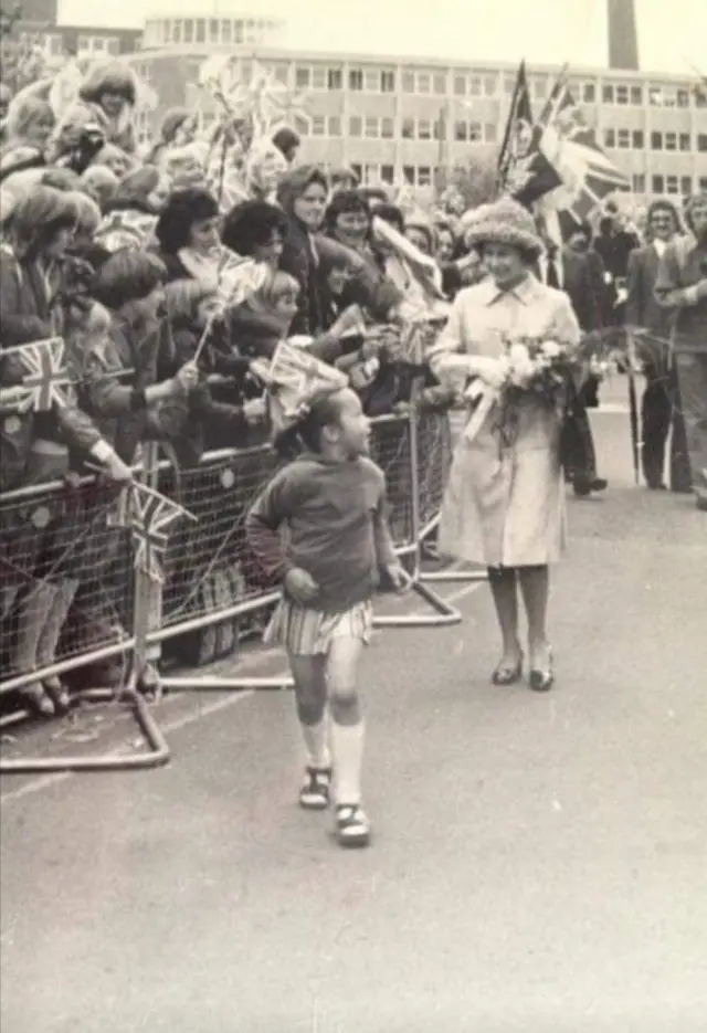 Michelle Martin after presenting the Queen with a bouquet.