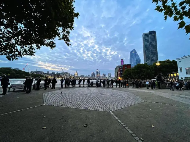 People queue along London's South Bank to pay their respects to Queen Elizabeth II