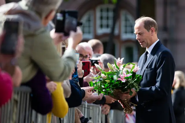 Prince Edward receiving flowers