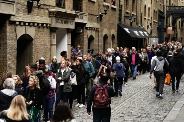 Members of the public in the queue at Butlers Wharf, central London, as they wait to view Queen Elizabeth II lying in state