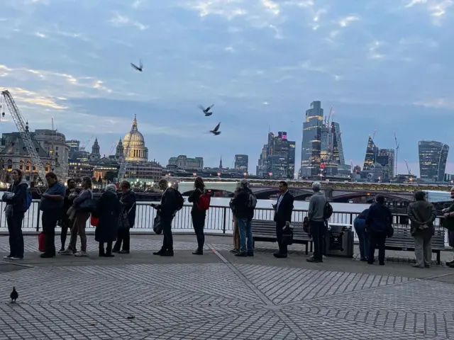 People queue along London's South Bank to pay their respects to Queen Elizabeth II