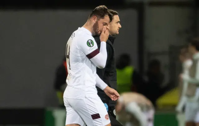 Craig Halkett leaves the pitch in Riga after 20 minutes