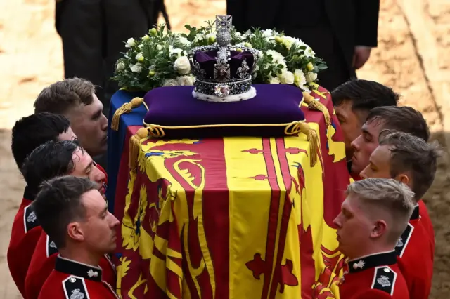 A bearer party carried the coffin of Queen Elizabeth II into Westminster Hall on Wednesday