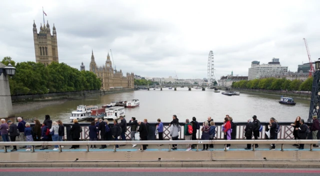 Members of the public in the queue on Lambeth Bridge, London