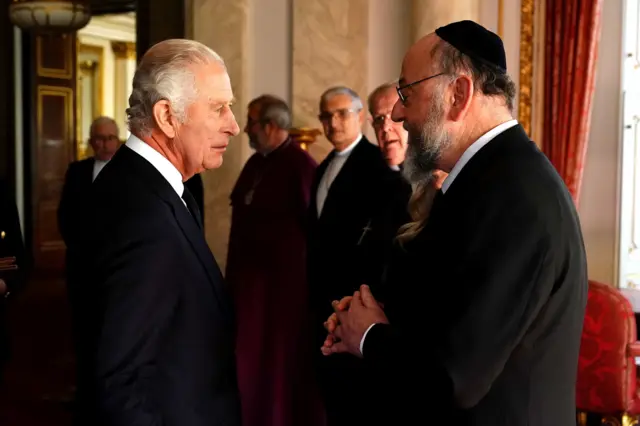 King Charles III speaks to Chief Rabbi Ephraim Mirvis