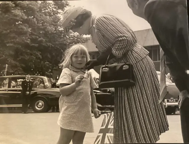 The Queen accepting a bag of sweets on her visit to the Open University in Milton Keynes in 1979