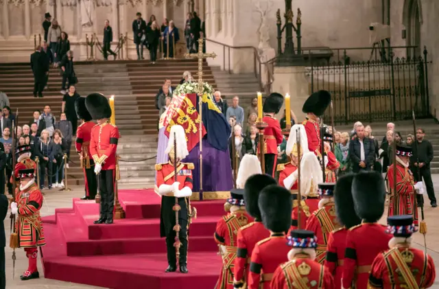 Members of the public file past the coffin of Queen Elizabeth II