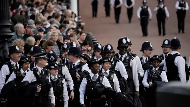 Police officers gather outside Buckingham Palace before the Queen's coffin was moved to Westminster Hall