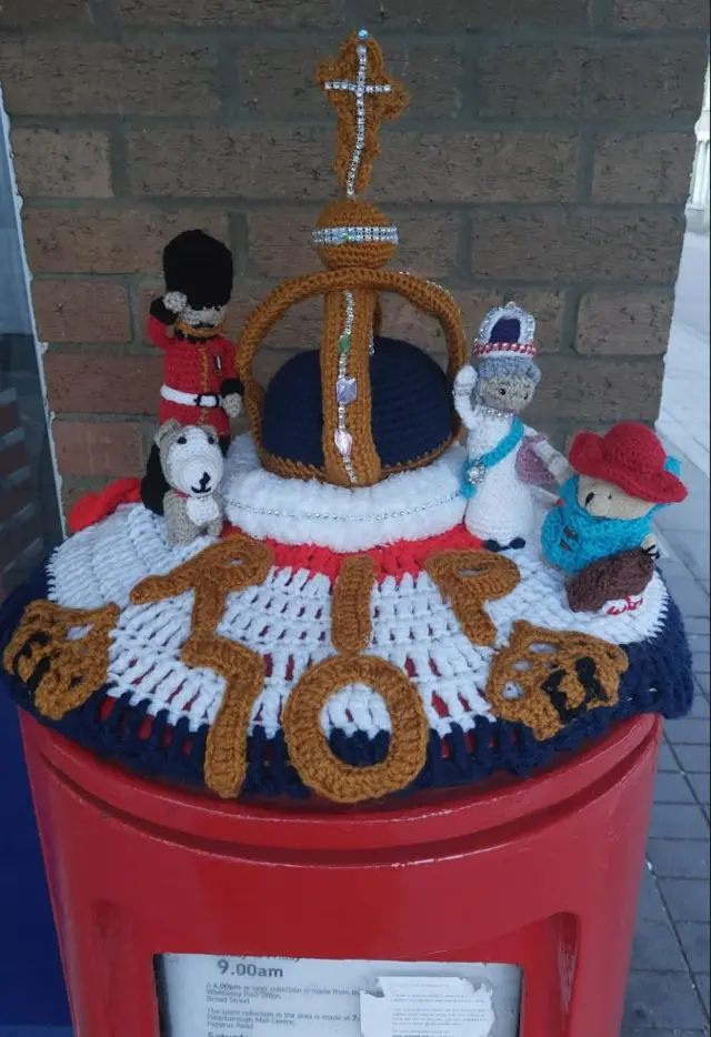 A postbox topper in tribute to the Queen, crocheted by Tracy Goude from Whittlesey, Cambridgeshire