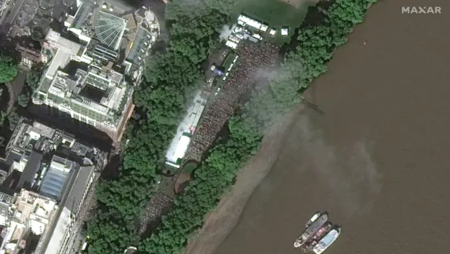 Satellite images show the thousands of people waiting to get into Westminster Hall