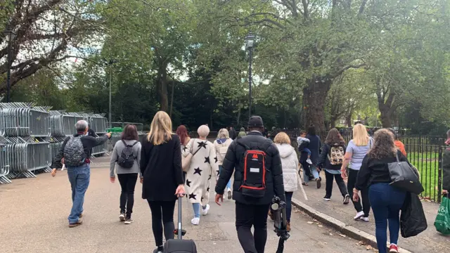 People heading to join the queue in Southwark Park