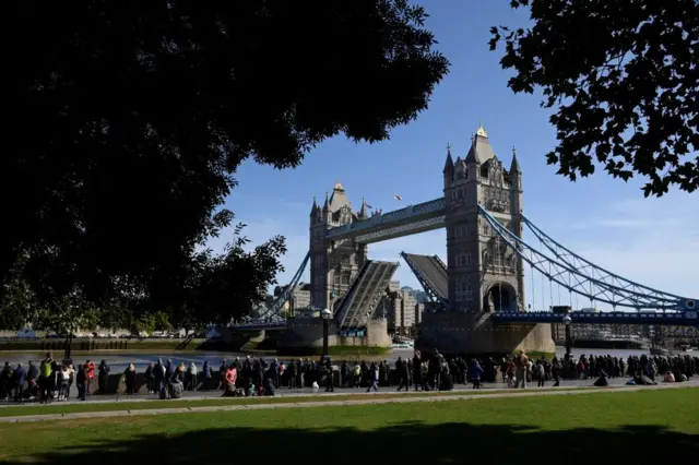 The queue passes Tower Bridge