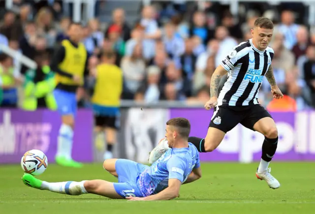 Ryan Christie (L) tackles Newcastle United's English defender Kieran Trippier