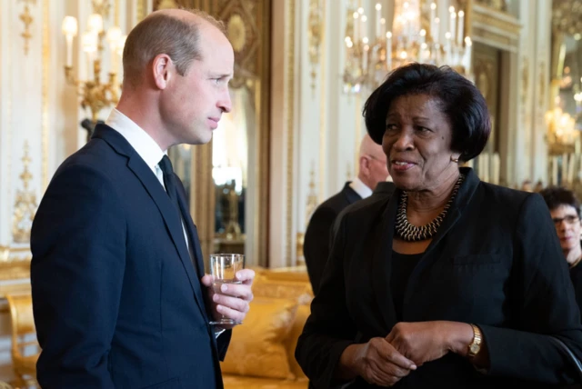 The Prince of Wales chats with the Governor of St Vincent and the Grenadines, Dame Susan Dougan during a lunch held for governors-general of the Commonwealth nations