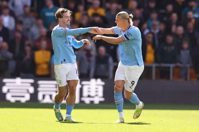 Jack Grealish and Erling Haaland