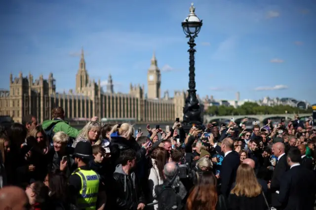 People in the queue meet Prince William on the Albert Embankment