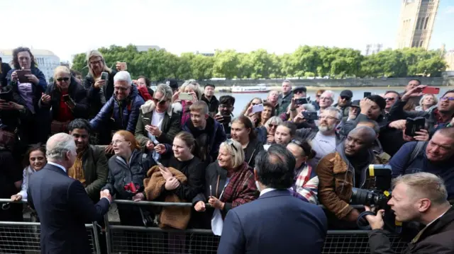 King Charles meets crowds in the queue