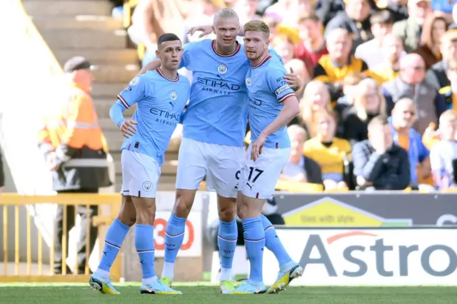 Erling Haaland of Manchester City celebrates with Phil Foden and Kevin De Bruyne