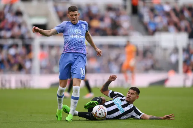 Bruno Guimaraes challenges Ryan Christie