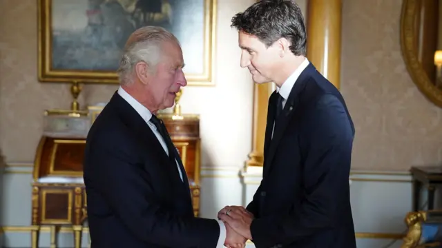 King Charles greets the Prime Minister of Canada, Justin Trudeau, at Buckingham Palace