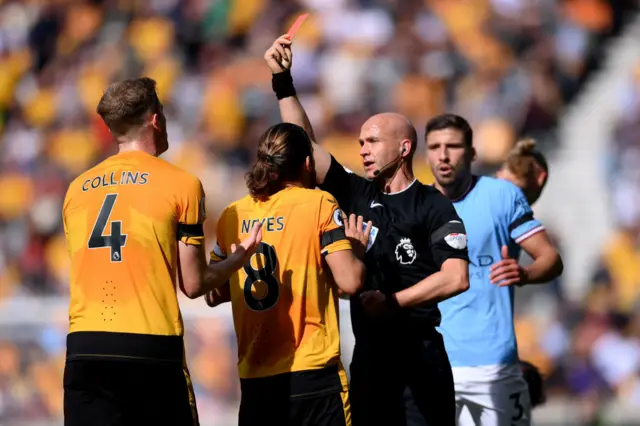 Nathan Collins of Wolverhampton Wanderers is shown a red card