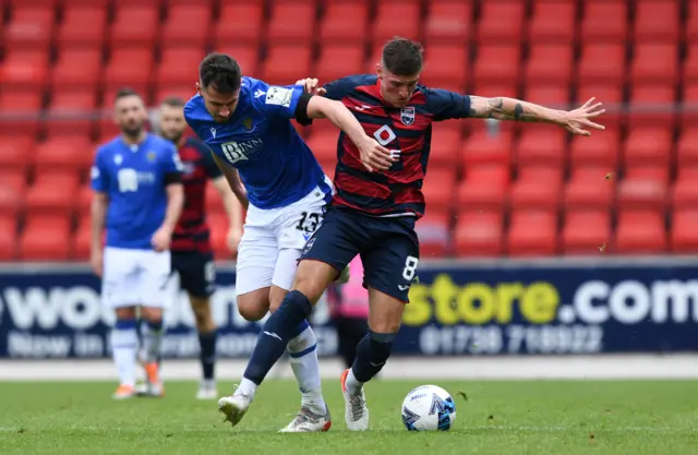 St Johnstone's Ryan McGowan (L) and Ross County's Ross Callachan in action during a cinch Premiership match between St. Johnstone and Ross County at McDiarmid Park