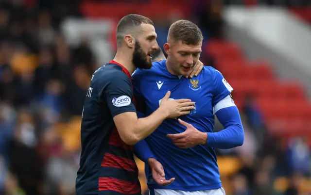 Ross County's Alex Iacovitti (L) and St Johnstone's Liam Gordon in action during a cinch Premiership match between St. Johnstone and Ross County at McDiarmid Park