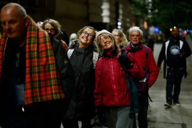 Two women in queue to see the Queen's coffin.