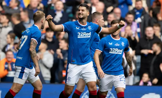 Antonio Colak celebrates his early strike at Ibrox