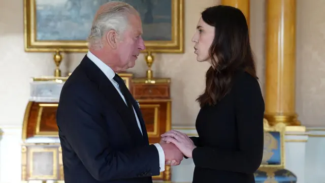 King Charles greets the Prime Minister of New Zealand, Jacinda Ardern, at Buckingham Palace