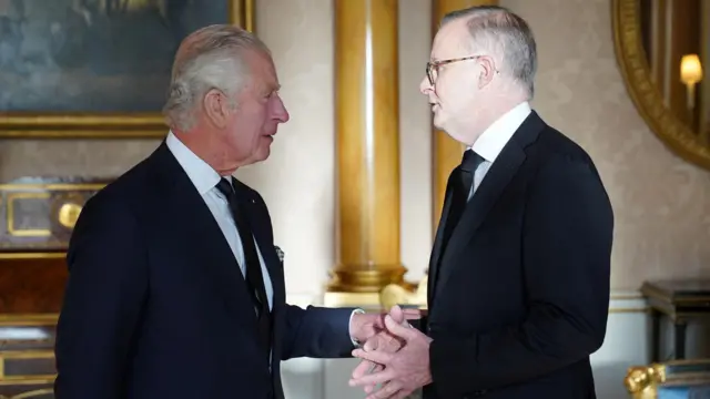 King Charles greets the Prime Minister of Australia, Anthony Albanese, at Buckingham Palace