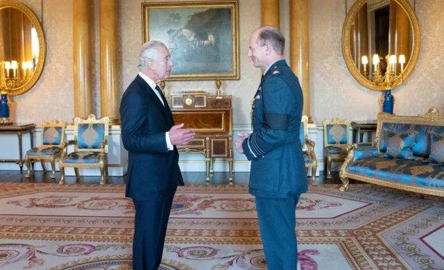 King Charles III greets Air Chief Marshal Sir Mike Wigston during a meeting with military chiefs of staff at Buckingham Palace